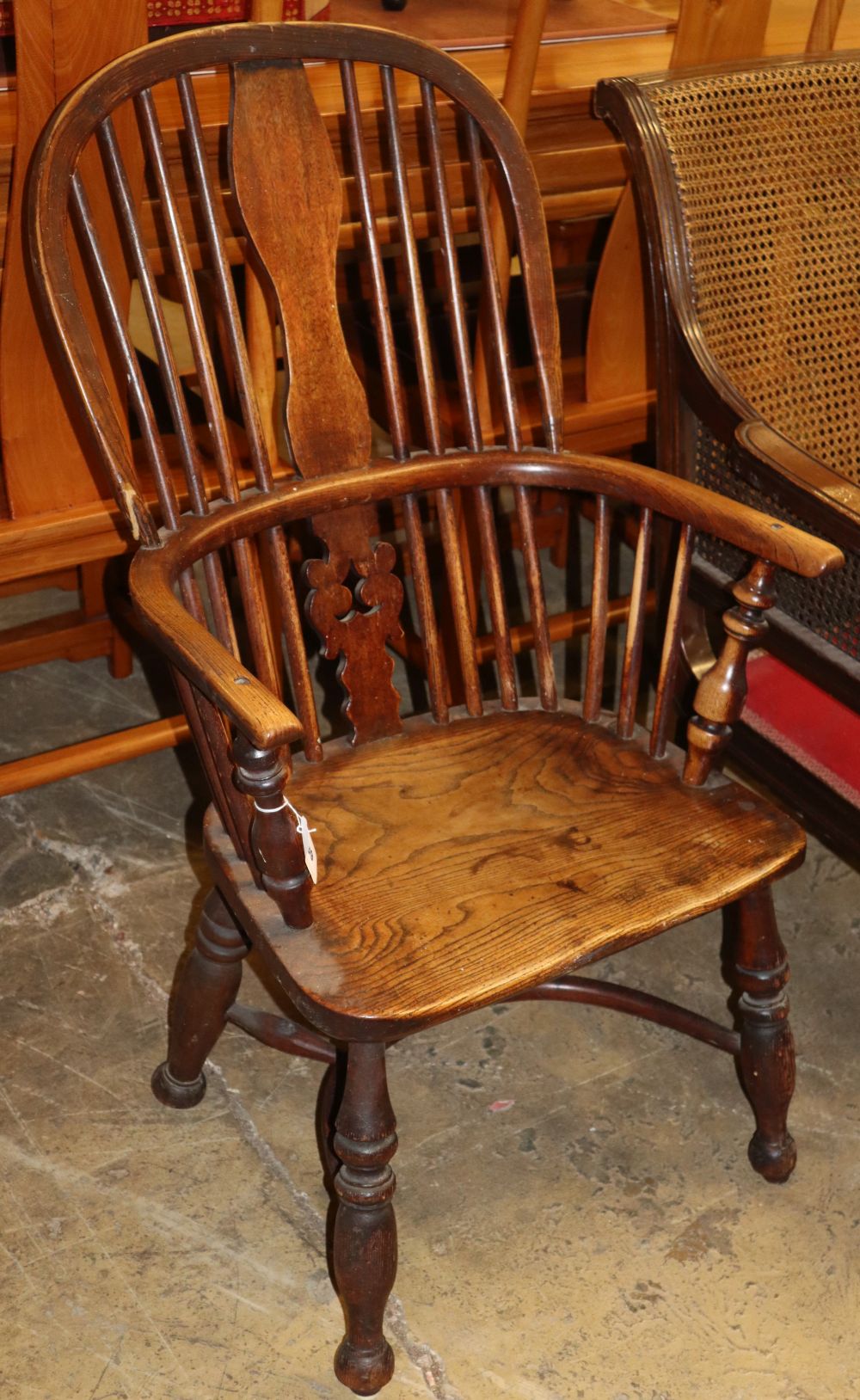 A Victorian ash and elm Windsor armchair (later upper splat)